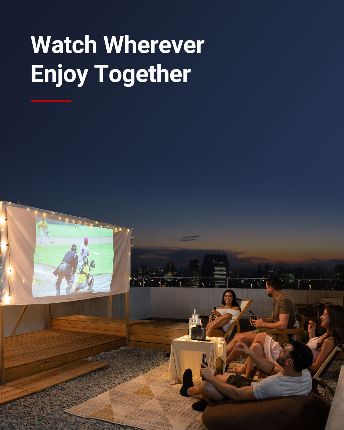 A group of friends use a Mars 2 Pro portable projector at night on their rooftop to watch a baseball batter bunt.